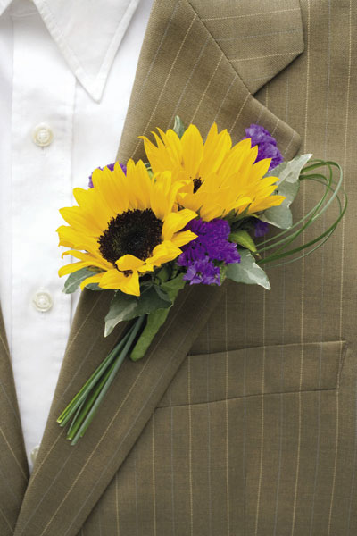 Mini Sunflowers make for lovely boutonnieres We can't claim responsibility